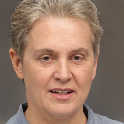 Joyful white middle-aged female with short  brown hair and brown eyes