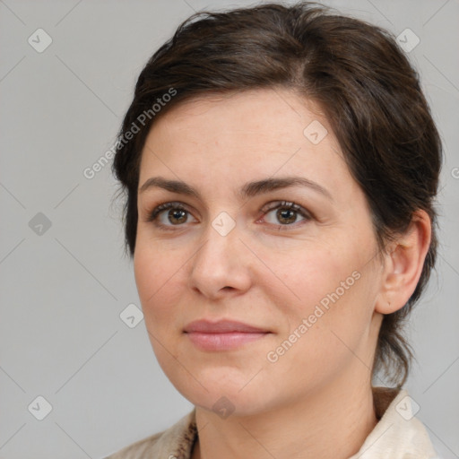 Joyful white adult female with medium  brown hair and brown eyes