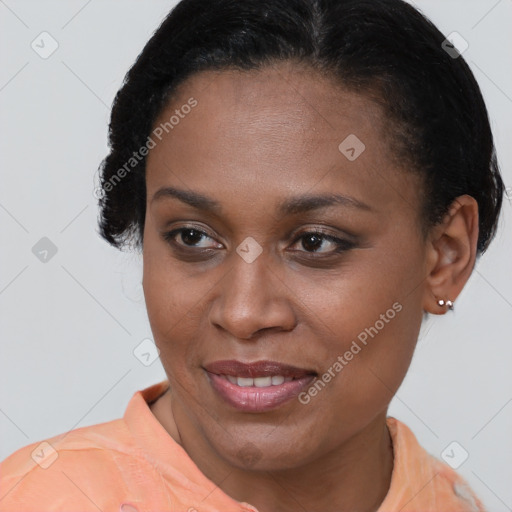 Joyful black young-adult female with short  brown hair and brown eyes