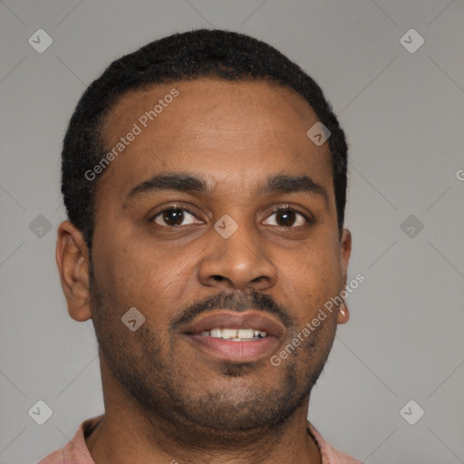 Joyful latino young-adult male with short  brown hair and brown eyes