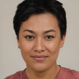 Joyful asian young-adult female with short  black hair and brown eyes