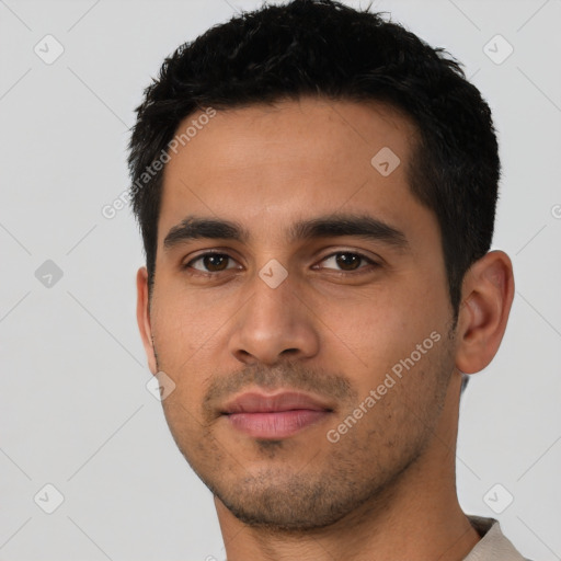 Neutral latino young-adult male with short  black hair and brown eyes