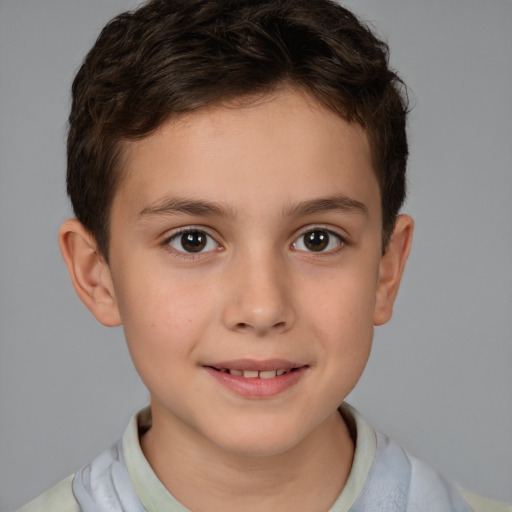 Joyful white child male with short  brown hair and brown eyes