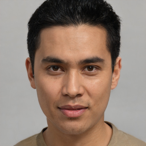 Joyful asian young-adult male with short  black hair and brown eyes