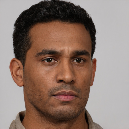 Neutral latino young-adult male with short  brown hair and brown eyes