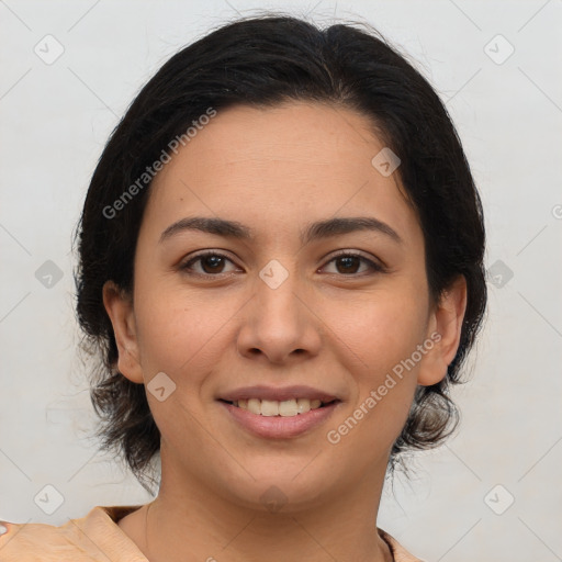 Joyful latino young-adult female with medium  brown hair and brown eyes