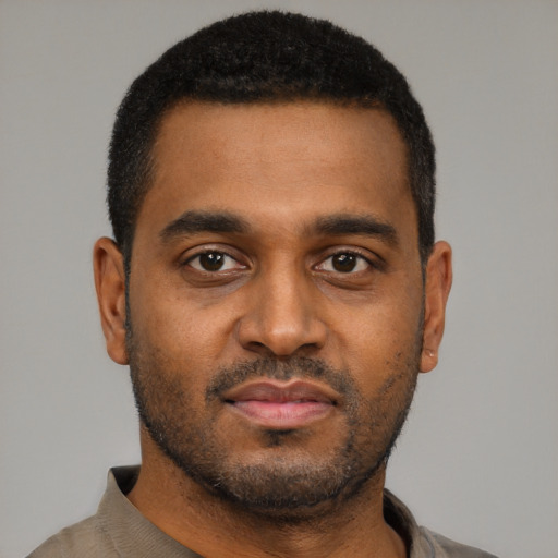 Neutral black young-adult male with short  black hair and brown eyes