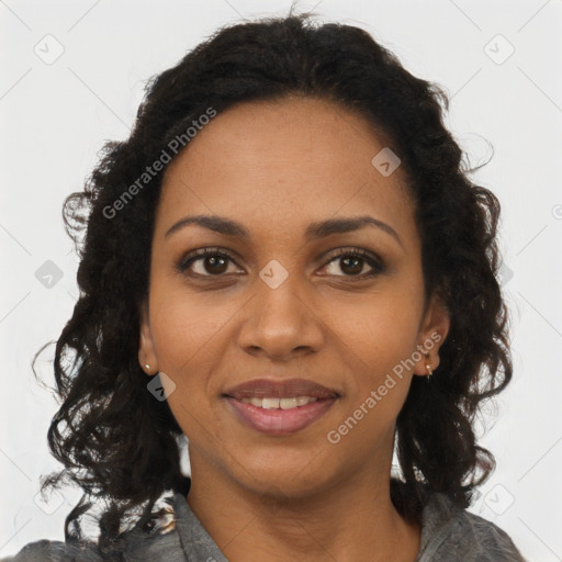 Joyful black young-adult female with long  brown hair and brown eyes