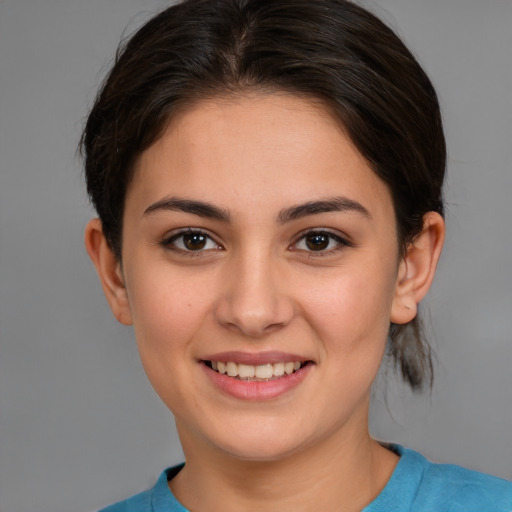 Joyful white young-adult female with medium  brown hair and brown eyes