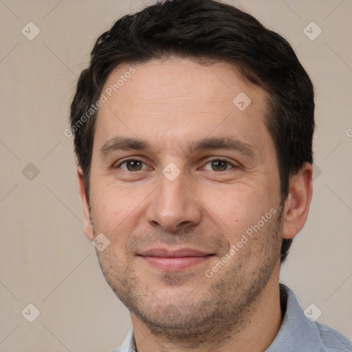 Joyful white adult male with short  brown hair and brown eyes