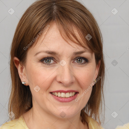 Joyful white adult female with medium  brown hair and brown eyes