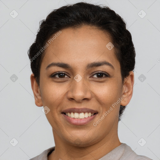 Joyful latino young-adult female with short  brown hair and brown eyes