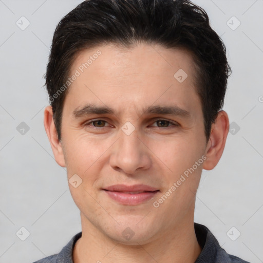 Joyful white adult male with short  brown hair and brown eyes