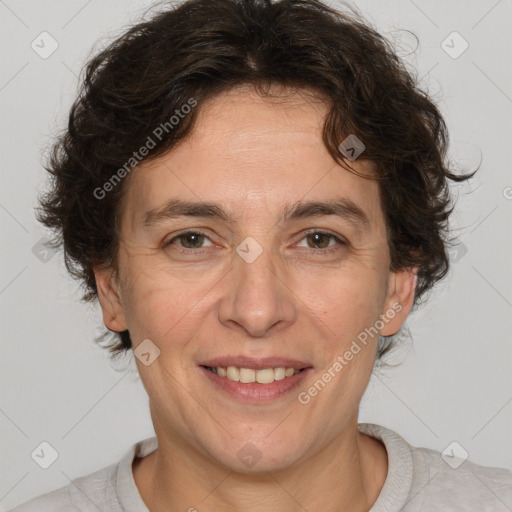 Joyful white adult female with short  brown hair and brown eyes