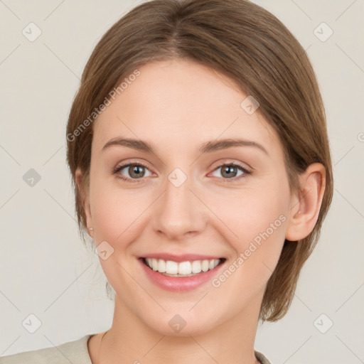 Joyful white young-adult female with medium  brown hair and green eyes