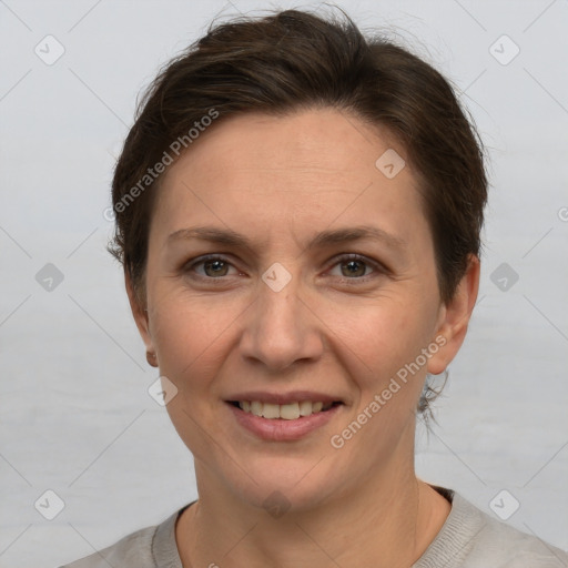 Joyful white adult female with short  brown hair and brown eyes