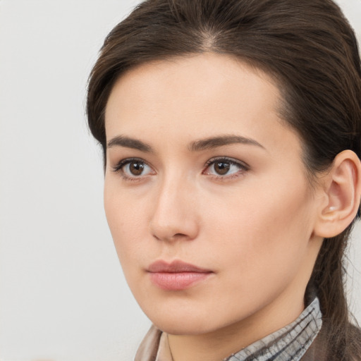 Neutral white young-adult female with long  brown hair and brown eyes