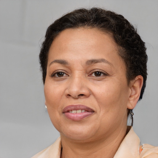 Joyful white adult female with short  brown hair and brown eyes