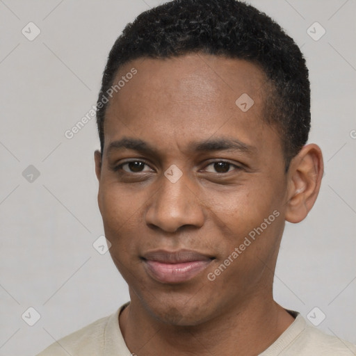 Joyful black young-adult male with short  black hair and brown eyes