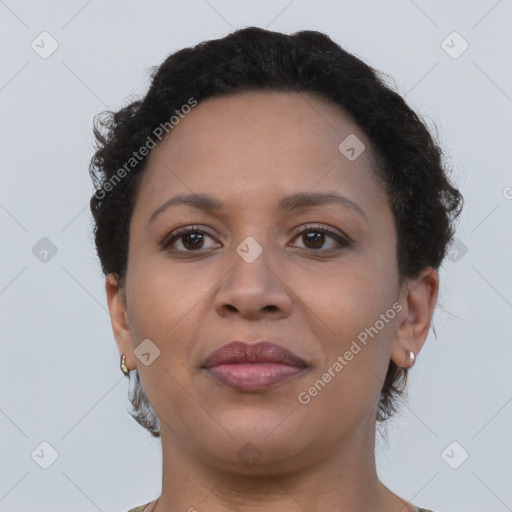 Joyful black young-adult female with short  brown hair and brown eyes