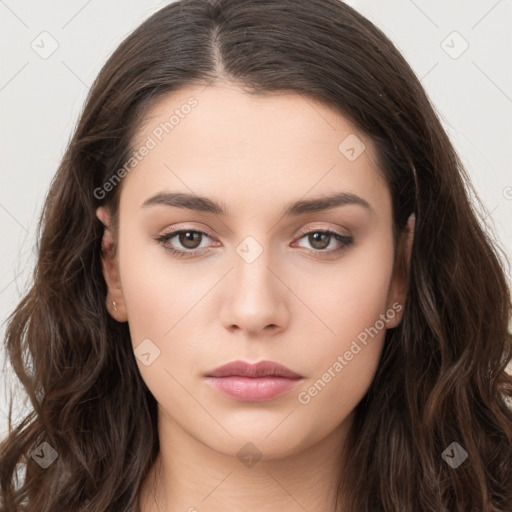 Neutral white young-adult female with long  brown hair and brown eyes