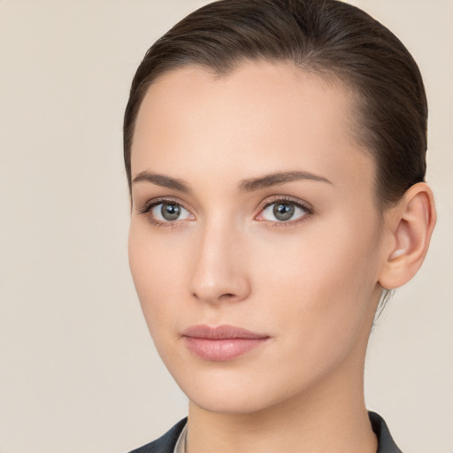 Neutral white young-adult female with long  brown hair and brown eyes