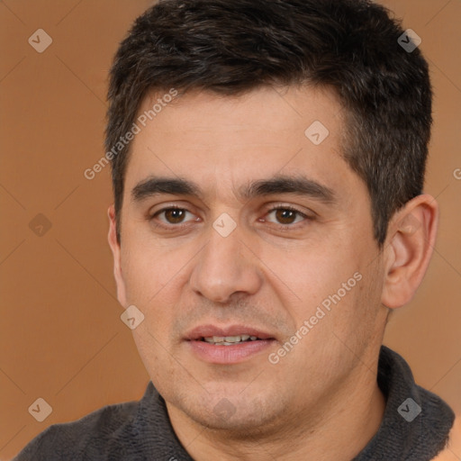 Joyful white adult male with short  brown hair and brown eyes