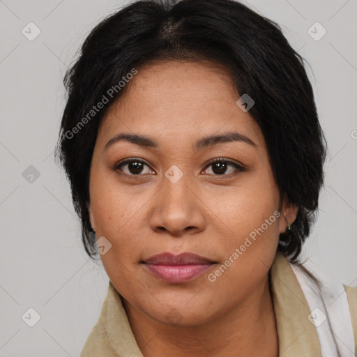 Joyful asian adult female with medium  brown hair and brown eyes