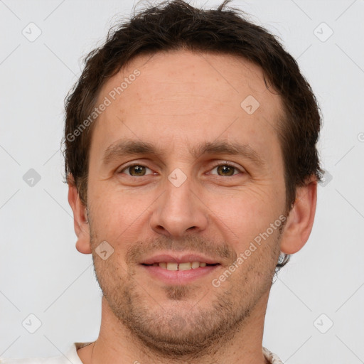 Joyful white adult male with short  brown hair and grey eyes