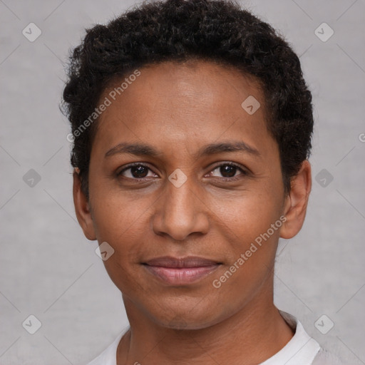 Joyful black young-adult female with short  brown hair and brown eyes