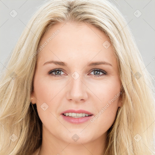 Joyful white young-adult female with long  brown hair and blue eyes