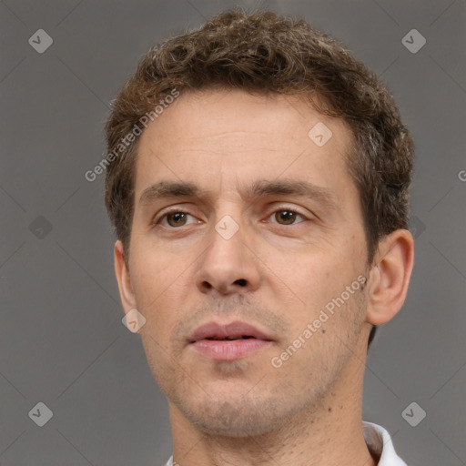 Neutral white adult male with short  brown hair and brown eyes