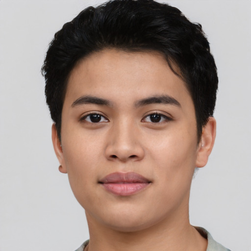 Joyful asian young-adult male with short  black hair and brown eyes