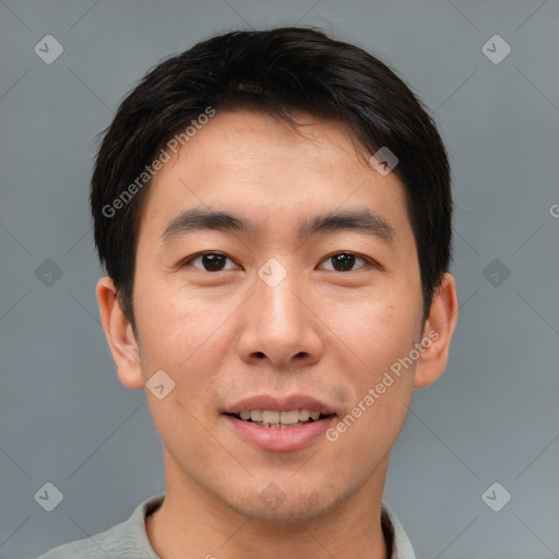 Joyful asian young-adult male with short  brown hair and brown eyes