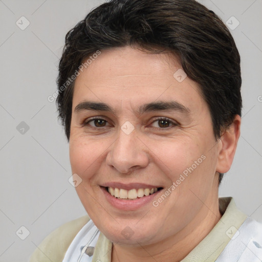 Joyful white adult female with short  brown hair and brown eyes