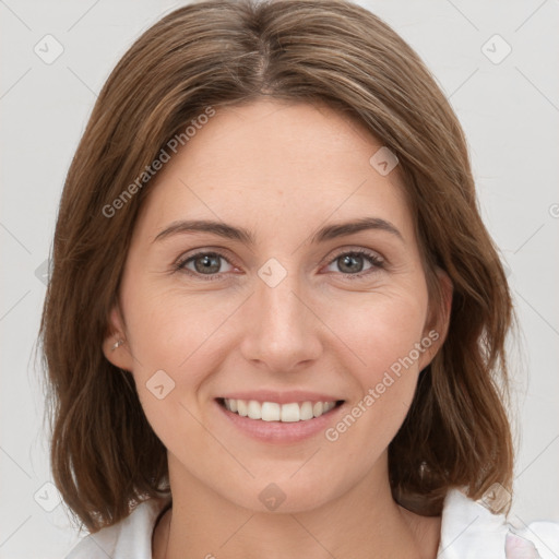 Joyful white young-adult female with medium  brown hair and green eyes