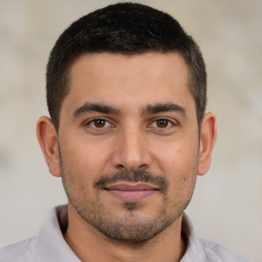 Neutral latino young-adult male with short  brown hair and brown eyes