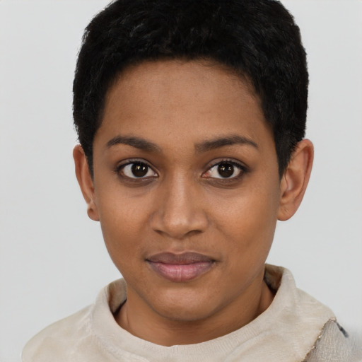 Joyful black young-adult female with short  black hair and brown eyes