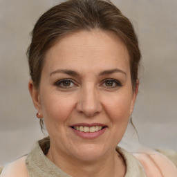 Joyful white adult female with short  brown hair and brown eyes