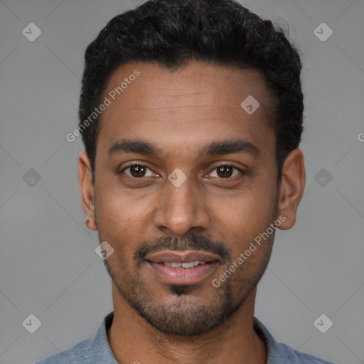 Joyful latino young-adult male with short  black hair and brown eyes