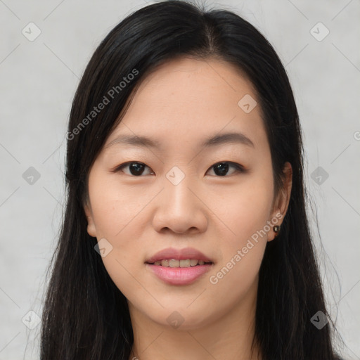 Joyful asian young-adult female with long  brown hair and brown eyes