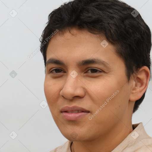 Joyful latino young-adult male with short  brown hair and brown eyes