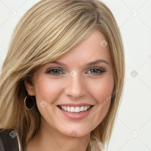 Joyful white young-adult female with long  brown hair and blue eyes