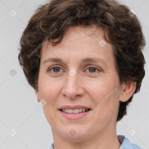 Joyful white adult female with short  brown hair and brown eyes