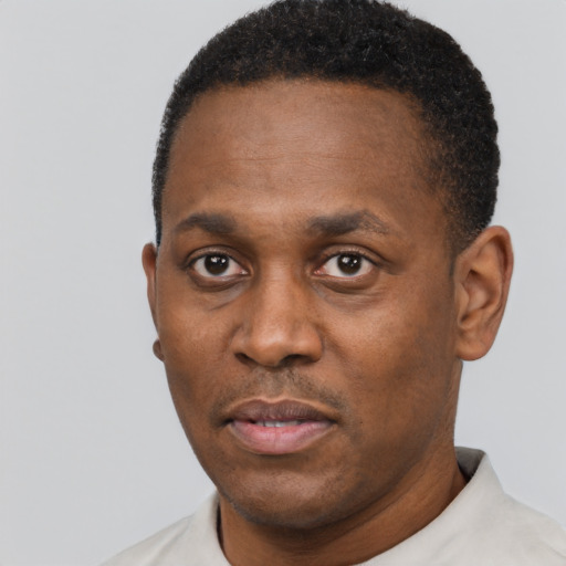 Neutral black adult male with short  black hair and brown eyes