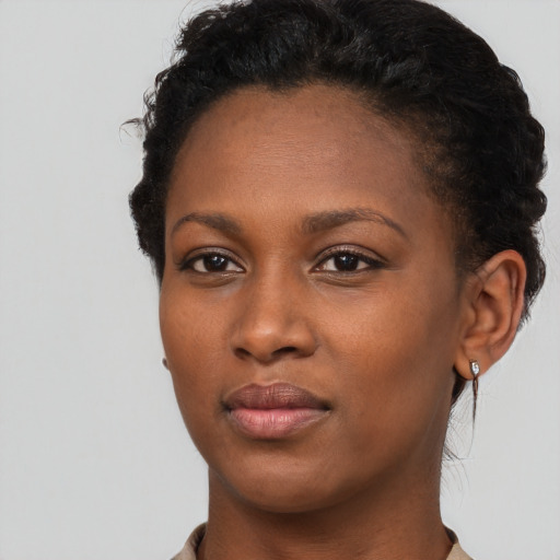 Neutral black young-adult female with short  brown hair and brown eyes