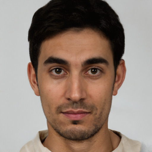 Neutral white young-adult male with short  black hair and brown eyes