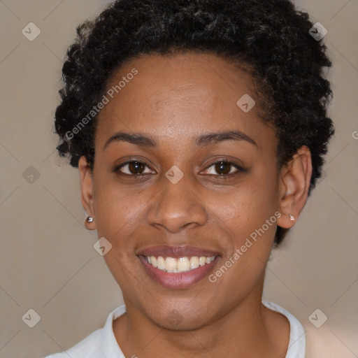 Joyful black young-adult female with short  brown hair and brown eyes