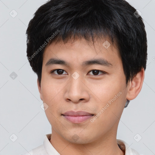 Joyful asian young-adult male with short  brown hair and brown eyes