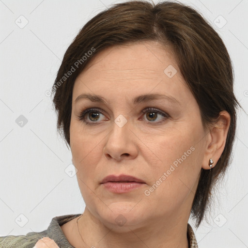 Joyful white adult female with medium  brown hair and brown eyes